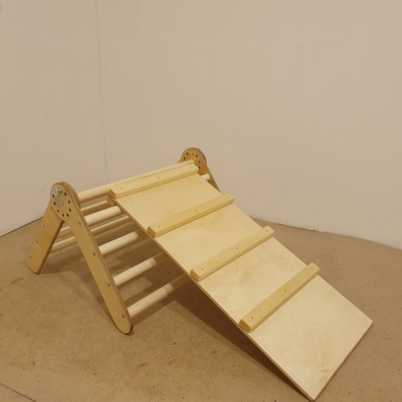 A small baby pikler triangle with a ladder board