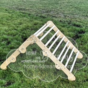 A wooden triangle climber toy on a lawn