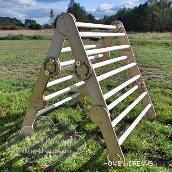 Wooden climbing toy placed on a field