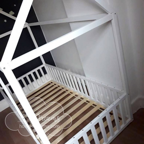 A floor bed frame with rails