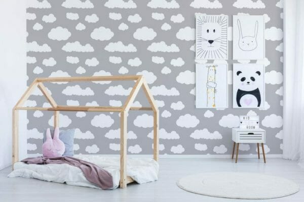 Self-adhesive wallpaper with a cloud pattern, applied in a baby nursery